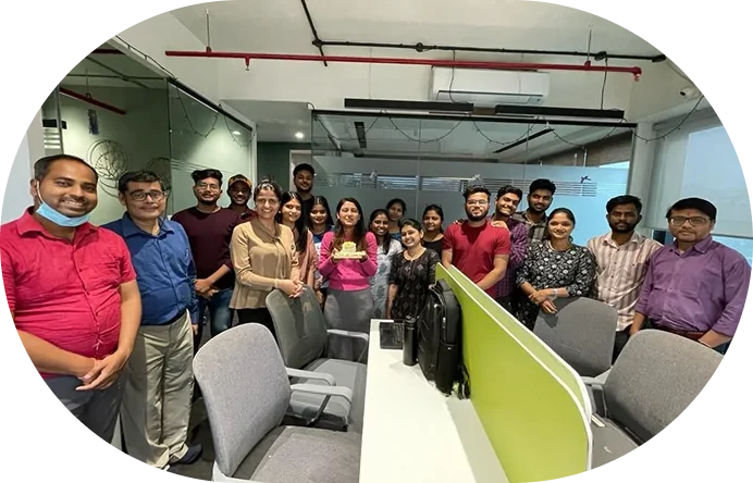 Brainmine team group photo celebrating in the office